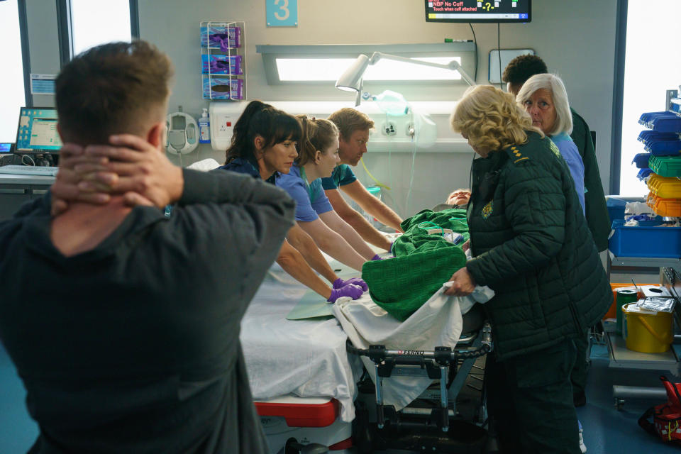 Casualty paramedics stretcher a patient into A&E. (BBC)