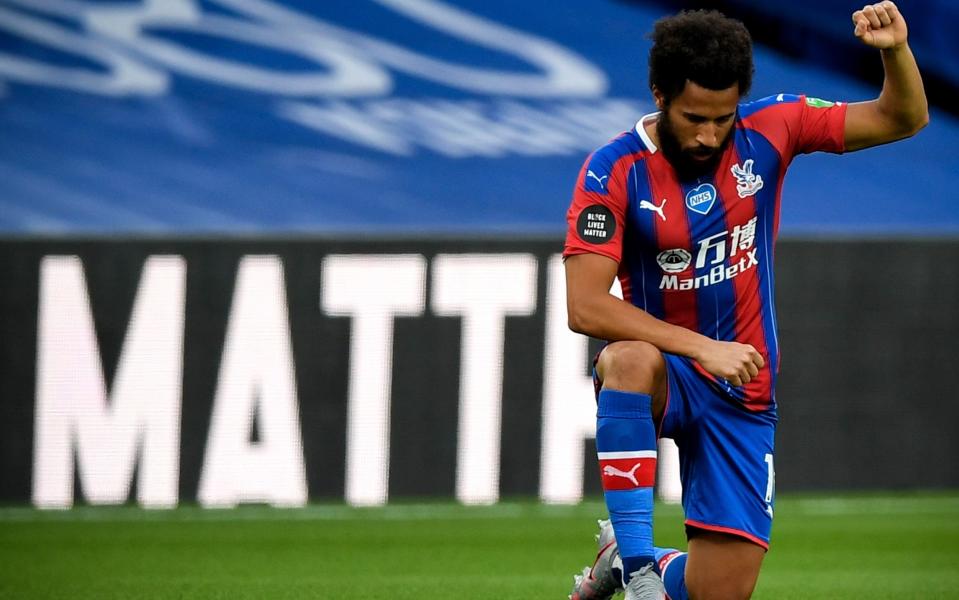 Crystal Palace's Andros Townsend kneels down to make a stand against racism prior to the English Premier League match between Crystal Palace and Burnley - Daniel Leal-Olivas/NMC/Pool/EPA-EFE/Shutterstock