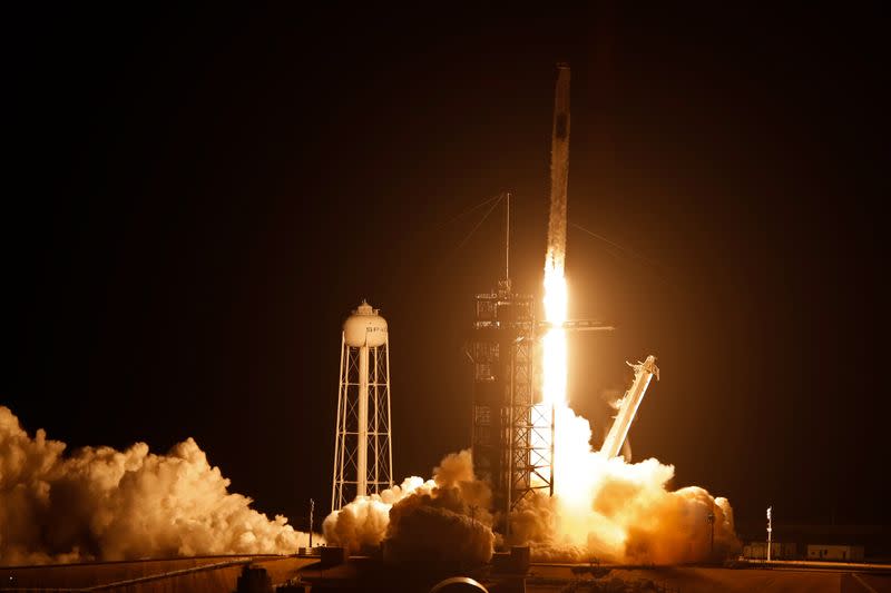 A SpaceX Falcon 9 rocket, with the Crew Dragon capsule, carrying four astronauts on a NASA commercial crew mission, launches at the Kennedy Space Center