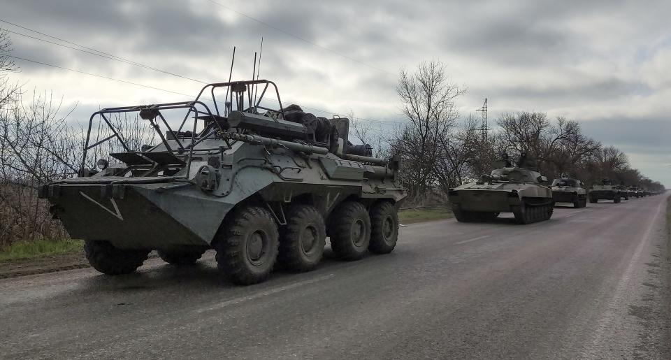 FILE - A Russian military convoy moves on a highway in an area controlled by Russian-backed separatist forces near Mariupol, Ukraine, on April 16, 2022. As the war in Ukraine stretches into its seventh month, North Korea is hinting at its interest in sending construction workers to help rebuild Russian-occupied territories in the country's east.(AP Photo/Alexei Alexandrov, File)