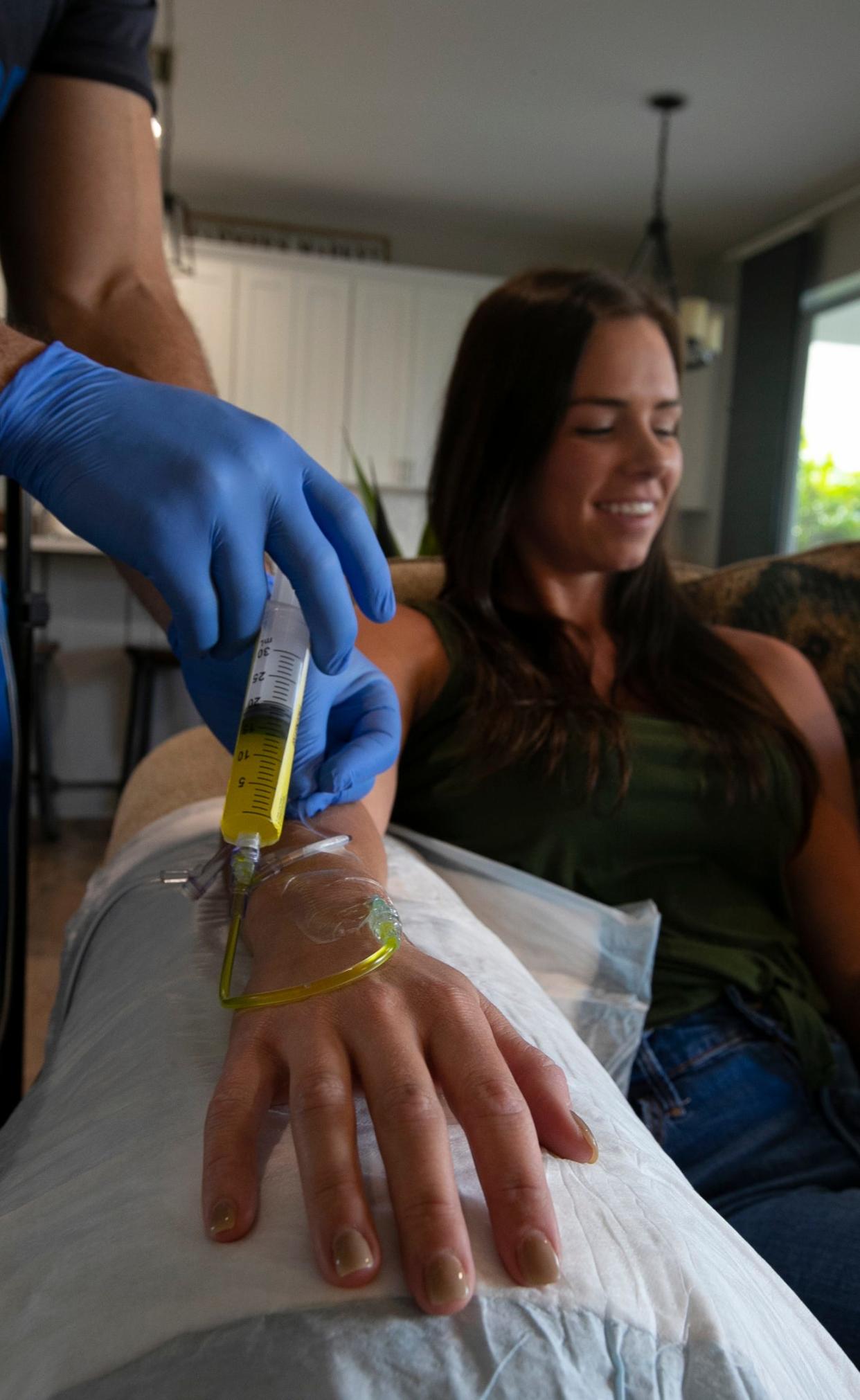 Lexi LoBosco, a partner with SWFL Health & Hydration, gets a Fastvitamin IV infusion during a presentation by Kasey Cook in Florida in 2021.