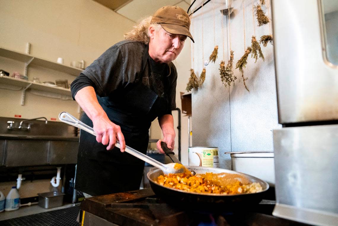 Clapp cooks the ingredients of a curried autumn vegetable soup on Nov. 9, 2022. They have a “locked-in” system, said Deshazo, for cooking 20 varieties daily — and it doesn’t involve rows and rows of pots. Cheyenne Boone/Cheyenne Boone/The News Tribune