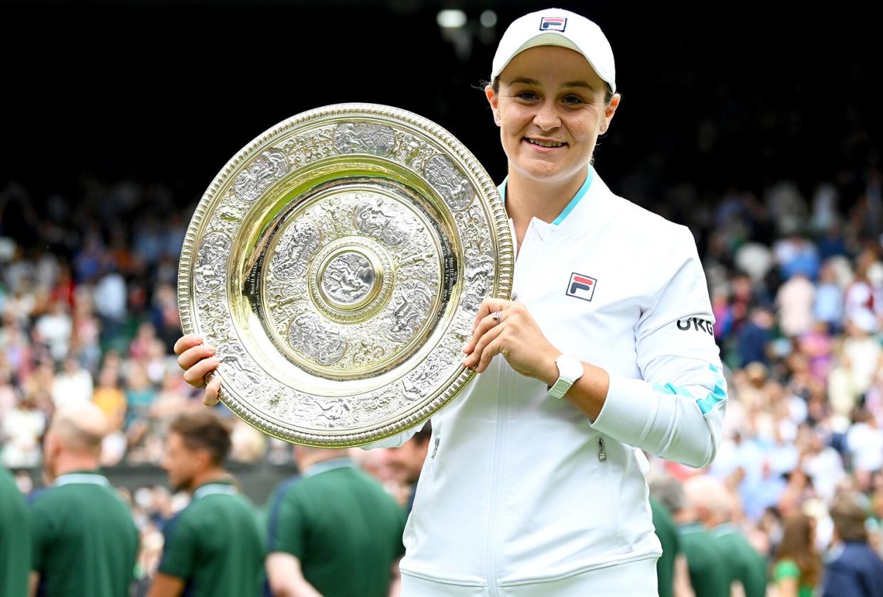 Ashleigh Barty of Australia is presented with the Venus Rosewater Dish trophy by HRH Catherine, The Duchess of Cambridge after winning her Ladies' Singles Final match against Karolina Pliskova of The Czech Republic at Wimbledon Championships Tennis Tournament at All England Lawn Tennis and Croquet Club on July 10, 2021 in London, England.