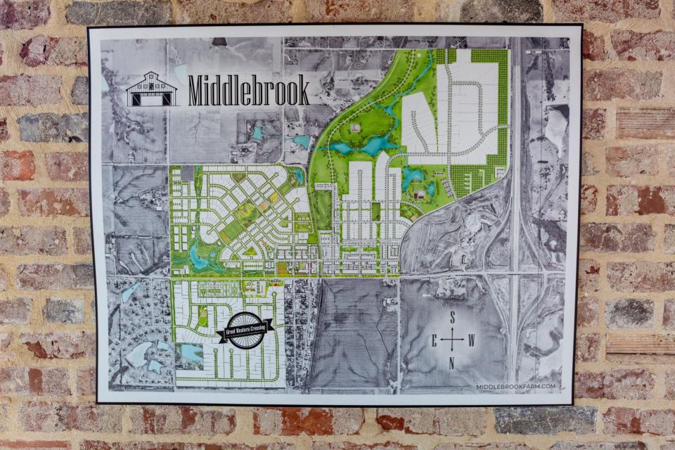 A map of the the Middlebook Agrihood community hangs at Middlebrook Mercantile, a new bar, event space, and retail center in Cumming, Wednesday, June 22, 2022. Wednesday, June 22, 2022.