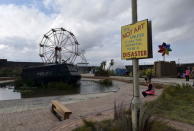 A sign is pictured at 'Dismaland', a theme park-styled art installation by British artist Banksy, at Weston-Super-Mare in southwest England, Britain, August 20, 2015. REUTERS/Toby Melville