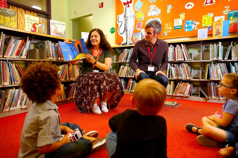 Youth services library staff read to children during a story time at Headquarters Library in downtown Gainesville in 2019.