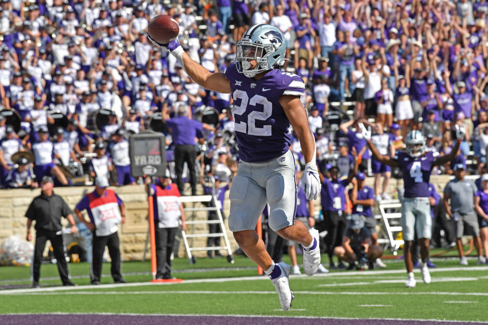 MANHATTAN, KS - SEPTEMBER 18:  Running back Deuce Vaughn #22 of the Kansas State Wildcats celebrates after scoring a touchdown against the Nevada Wolf Pack during the second half at Bill Snyder Family Football Stadium on September 18, 2021 in Manhattan, Kansas. (Photo by Peter Aiken/Getty Images)