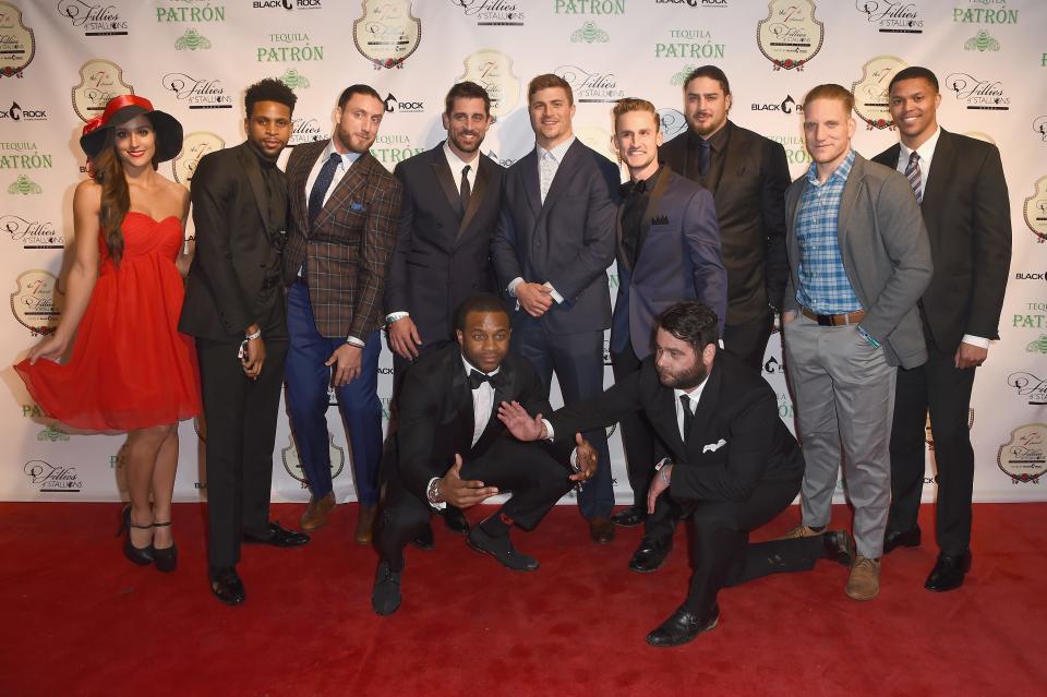 Aaron Rogers posed with some of his Green Bay Packers teammates and the Fillies & Stallions Kentucky Derby party