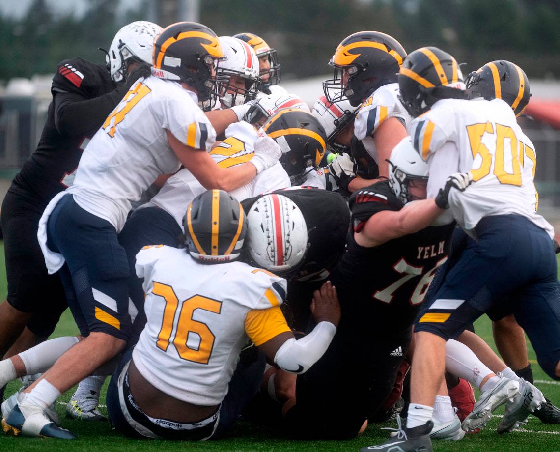 Somewhere in this pile was the game-winning touchdown for the Yelm Tornados in their 28-27 victory over the Bellevue Wolverines in Saturday afternoon’s 3A football state semifinal game at Art Crate Field in Spanaway, Washington, on Nov. 26, 2022.