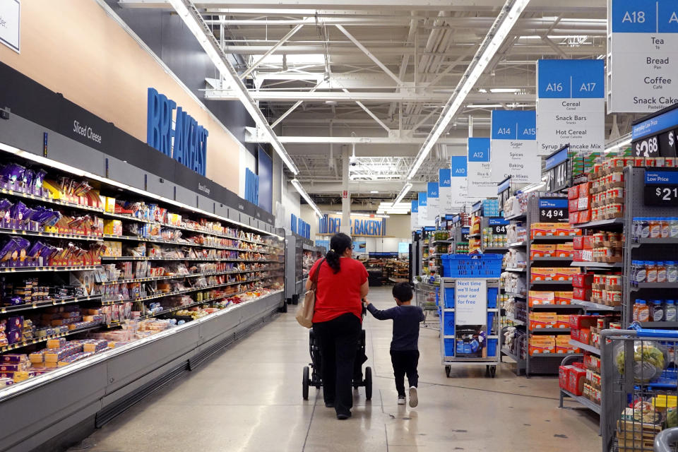 CHICAGO, ILLINOIS - MAY 18: Customers shop at a Walmart store on May 18, 2023 in Chicago, Illinois. Walmart, the world's largest retailer, today reported first-quarter same-store sales growth that beat expectations and the company raised its full-year forecast.   (Photo by Scott Olson/Getty Images)