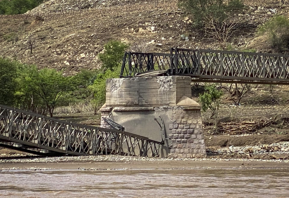 A destroyed bridge crossing the Tekeze River is seen in the Tigray region of northern Ethiopia Thursday, July 1, 2021. The bridge that is crucial to delivering desperately needed food to much of Ethiopia's embattled Tigray region has been destroyed, aid groups said Thursday. (Roger Sandberg/Medical Teams International via AP)