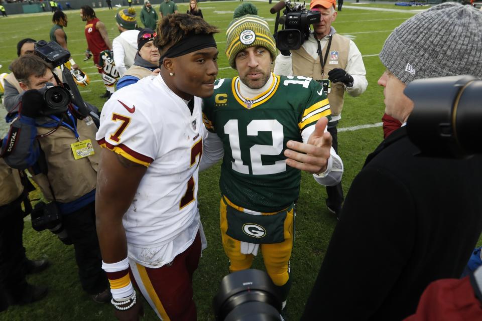 Green Bay Packers' Aaron Rodgers talks to Washington Redskins' Dwayne Haskins after an NFL football game Sunday, Dec. 8, 2019, in Green Bay, Wis. The Packers won 20-15. (AP Photo/Mike Roemer)