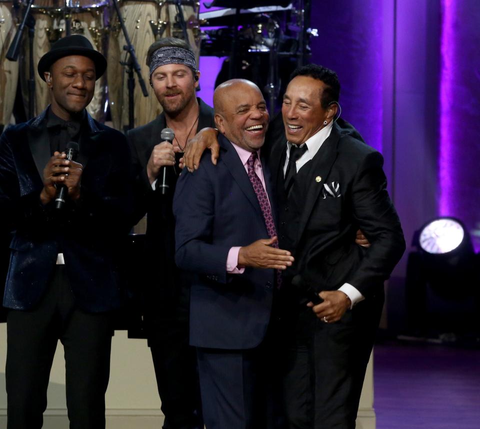 Motown founder Berry Gordy and Smokey Robinson hug onstage as Robinson is honored with the Gershwin Prize in Washington, D.C., on Nov. 16, 2016.