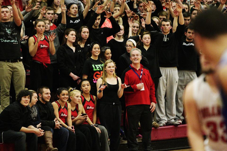 Old Rochester fans and the school's athletic director, Bill Tilden.