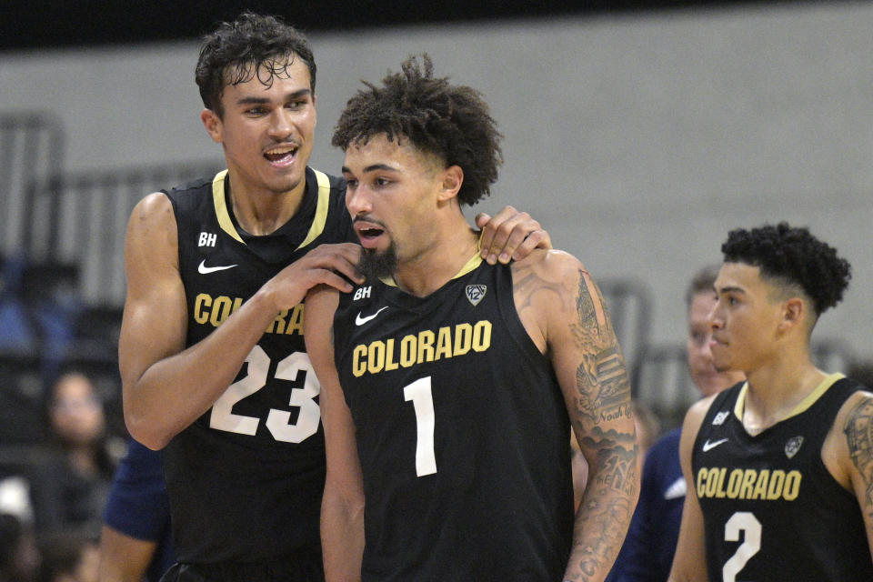 Colorado forward Tristan da Silva (23) and guard J'Vonne Hadley (1) celebrate their win against Richmond during an NCAA college basketball game, Monday, Nov. 20, 2023, in Daytona Beach, Fla. (AP Photo/Phelan M. Ebenhack)