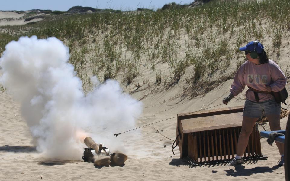 A Lyle gun is fired in 2006 at the Cape Cod National Seashore's Beach Apparatus Drill program at Old Harbor Life-Saving Station in Provincetown.