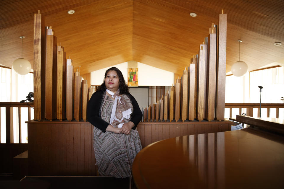 Rosa Gutierrez Lopez, from el Salvador, who a year ago became the first unauthorized immigrant to get refuge inside a religious institution in the Washington area, poses for a portrait at Cedar Lane Unitarian Universalist Church where she has been living in sanctuary for a year due to a deportation order, in Bethesda, Md., Thursday, Dec. 5, 2019. (AP Photo/Jacquelyn Martin)