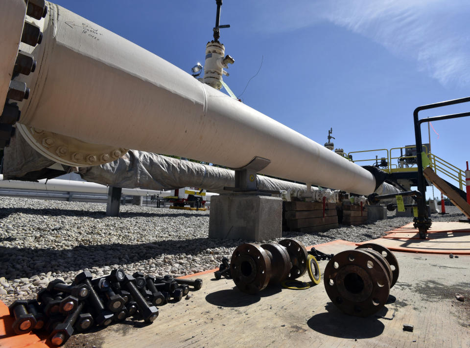 FILE - In this June 8, 2017, file photo, fresh nuts, bolts and fittings are ready to be added to the east leg of the pipeline near St. Ignace, Mich., as Enbridge prepares to test the east and west sides of the Line 5 pipeline under the Straits of Mackinac in Mackinaw City, Mich. The Michigan Public Service Commission has some authority over Enbridge's plans to build an oil pipeline tunnel beneath the channel that connects two of the Great Lakes, a state administrative law judge ruled Friday, Oct. 23, 2020. (Dale G Young/Detroit News via AP, File)