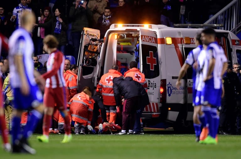 Atletico Madrid's Fernando Torres was evacuated in an ambulance after he was knocked unconscious during the Spanish league match against Deportivo La Coruna at the Riazor stadium on March 2, 2017