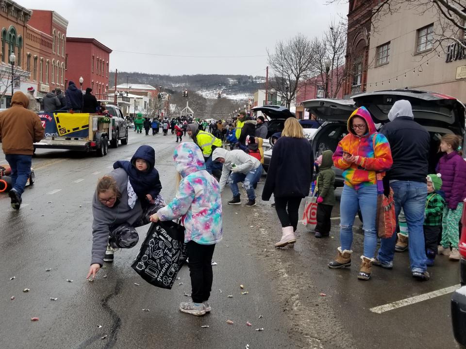 Little spectators scoop up candy during the 2022 St. Patrick's Day parade in Hornell. This year's parade is Saturday.