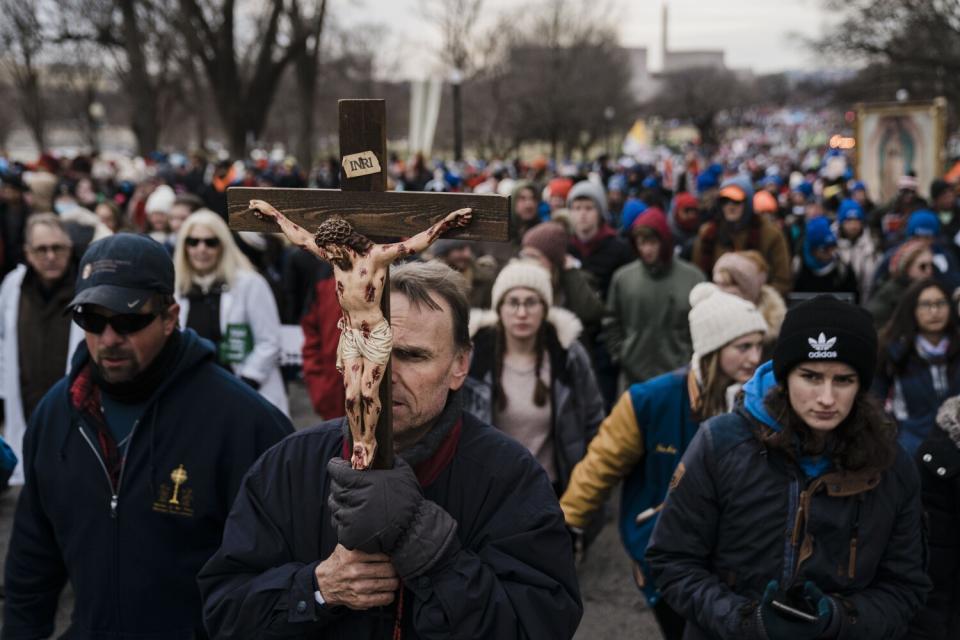 Richard Mahoney, of Baton Rouge, La., holds a cross during the March for Life protest in Washington in January.