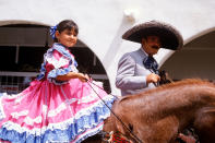 <p>Mexican-Americans participate in the July 4th Parade in Ojai, Calif., 2002. (Photo: Visions of America/UIG via Getty Images) </p>