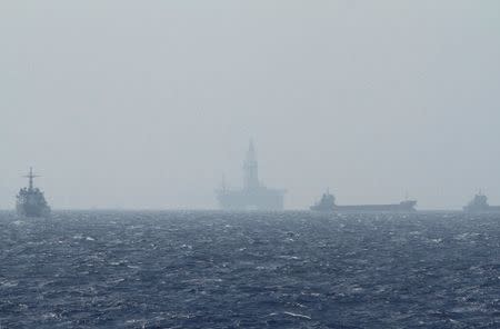 An oil rig (C) which China calls Haiyang Shiyou 981, and Vietnam refers to as Hai Duong 981, is seen in the South China Sea, off the shore of Vietnam in this May 14, 2014 file photo. REUTERS/Minh Nguyen/File Photo