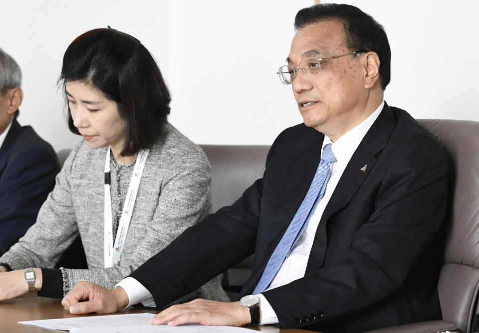 China's Prime Minister Li Keqiang, right, participates in a meeting on the sidelines of an EU-ASEM summit in Brussels, Friday, Oct. 19, 2018. EU leaders meet with their Asian counterparts Friday to discuss trade, among other issues. (Piroschka van de Wouw, Pool Photo via AP)