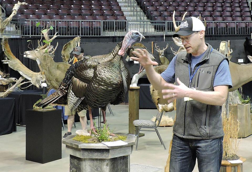  Jens Jorgensen, president of the Pennsylvania Taxidermist Association, talks Friday about mounting a turkey.    