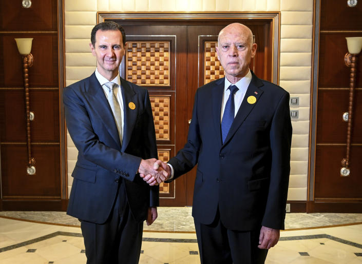 In this photo provided by the Tunisian Presidency, Tunisian President Kais Saied, right, shakes hand with Syrian President Bashar Assad, in Jeddah, Saudi Arabia, during the Arab summit, Friday, May 19, 2023. (Slim Abid/Tunisian Presidency via AP)