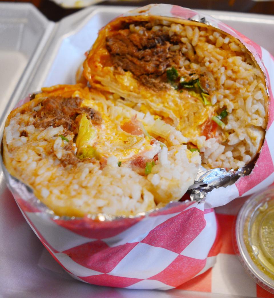 Burritoes are another option at El Compa Taqueria, a restaurant inside the Shell gas station on Ind. 46. This is the beef birria burrito, shown Feb. 16, 2024.