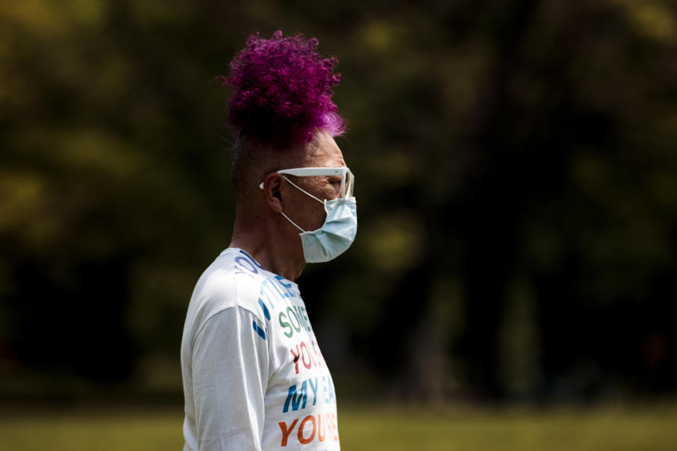 A man wearing a face mask amid concerns over the spread of COVID-19 coronavirus walks at a park during Japan's "Golden Week" holiday in Tokyo on April 30, 2020. (Photo by Behrouz MEHRI / AFP) (Photo by BEHROUZ MEHRI/AFP via Getty Images)