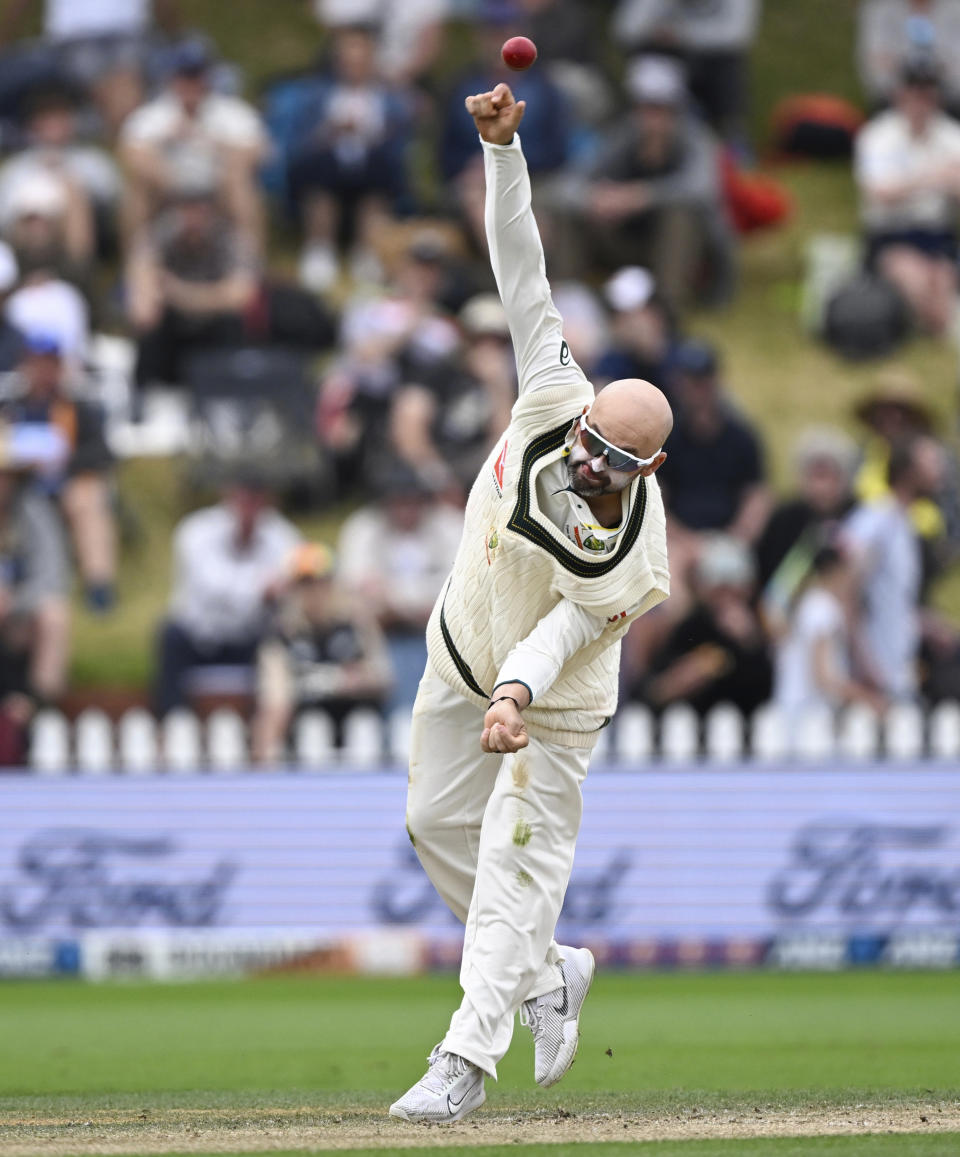 Australia's Nathan Lyon bowls on day four of the first cricket test match between New Zealand and Australia at the Basin Reserve in Wellington, New Zealand, Sunday, March 3, 2024. (Andrew Cornaga/Photosport via AP)