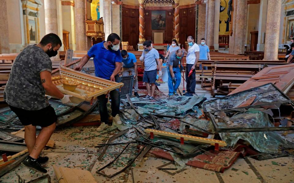 The inside of the Saint George Greek Orthodox Cathedral, located 1km from the blast site, is left in ruins - Joseph Eid/AFP