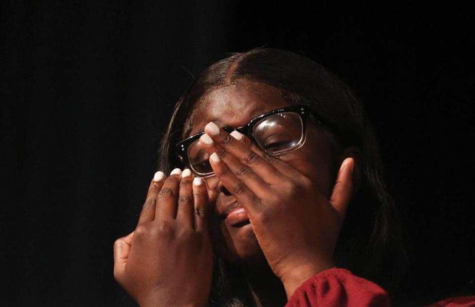 Azorea McGill, senior at Booker T. Washington Senior High in Miami, reacts after learning she will receive a $30,000 college scholarship from the Biscayne Bay Kiwanis Club during the Student Awards Ceremony Tuesday, May 24, 2022, at the school. McGill, the class president, will be attending Alabama State University in the fall.