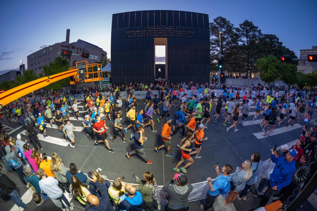 Runners go past the 9:03 Gate of Time during the Oklahoma City Memorial Marathon, Run to Remember, Sunday, April 30, 2023.