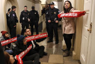 <p>Diana Colin, right, with the Coalition for Humane Immigrant Rights (CHIRLA), shouts, “McCarthy you have no heart,” as the group from California protests outside the office of House Majority Leader Kevin McCarthy of Calif., Thursday, Jan. 18, 2018, on Capitol Hill in Washington, in favor of the Deferred Action for Childhood Arrivals (DACA) program. Several members of the group were arrested by Capitol Police. (Photo: Jacquelyn Martin/AP) </p>