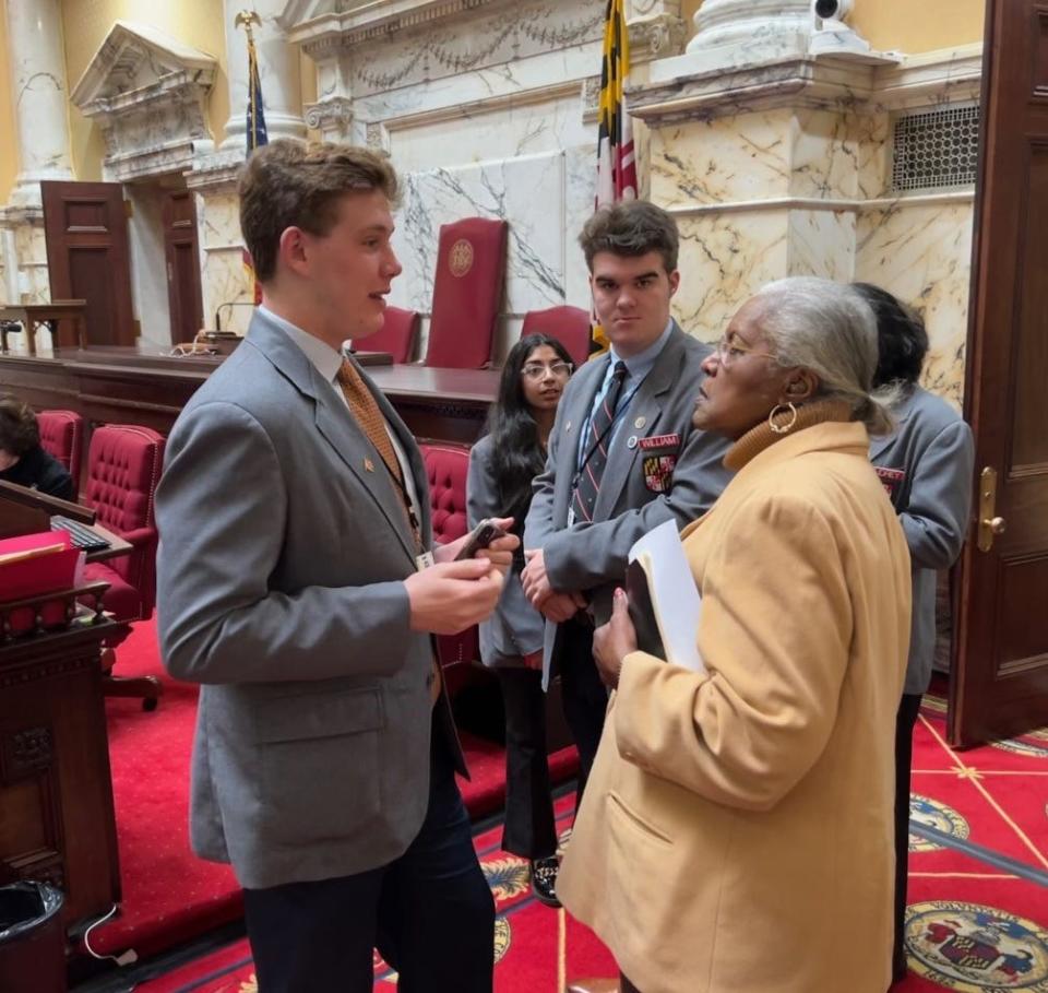 In this file photo, Maryland state Sen. Joanne Benson, D-Prince George's, right, speaks to student pages after votes on the Senate floor in Annapolis on Feb. 16, 2023.