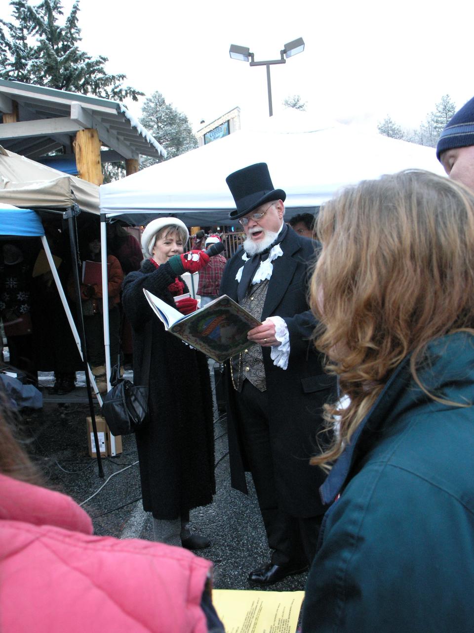 Doug Austin reading from his antique copy of " 'Twas the Night Before Christmas" to the crowd at the 2009 Tree Lighting Festival in Idyllwild.