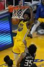 Golden State Warriors center James Wiseman (33) dunks over Sacramento Kings forward Marvin Bagley III (35) during the first half of an NBA basketball game in San Francisco, Monday, Jan. 4, 2021. (AP Photo/Jeff Chiu)