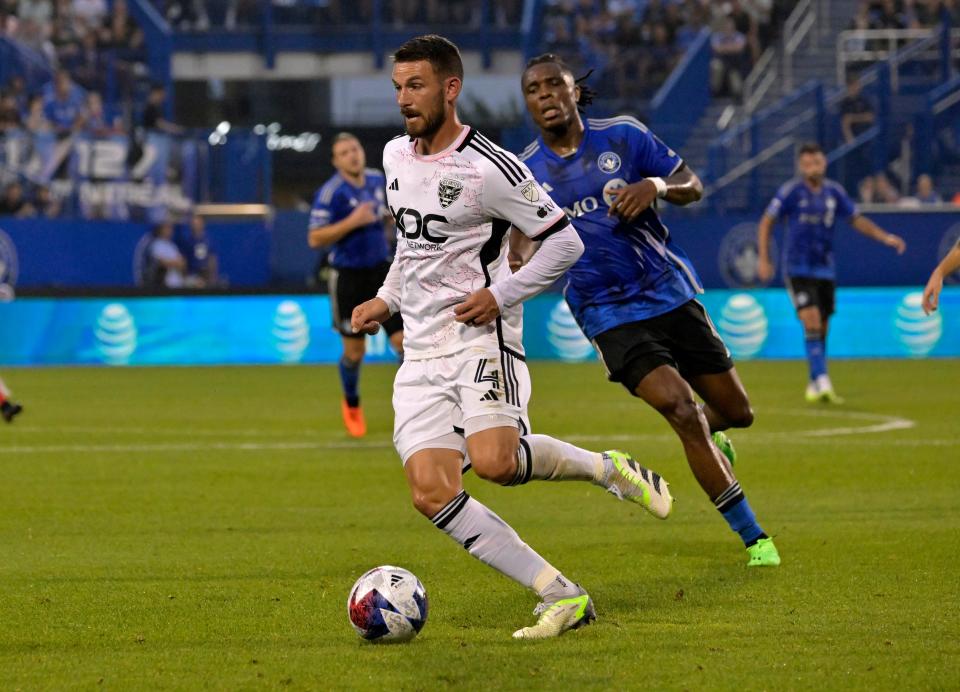 Jul 26, 2023; Montreal, Quebec, CAN; D.C. United defender Brendan Hines-Ike (4) plays the ball against the CF Montreal during the first half at Stade Saputo. Mandatory Credit: Eric Bolte-USA TODAY Sports