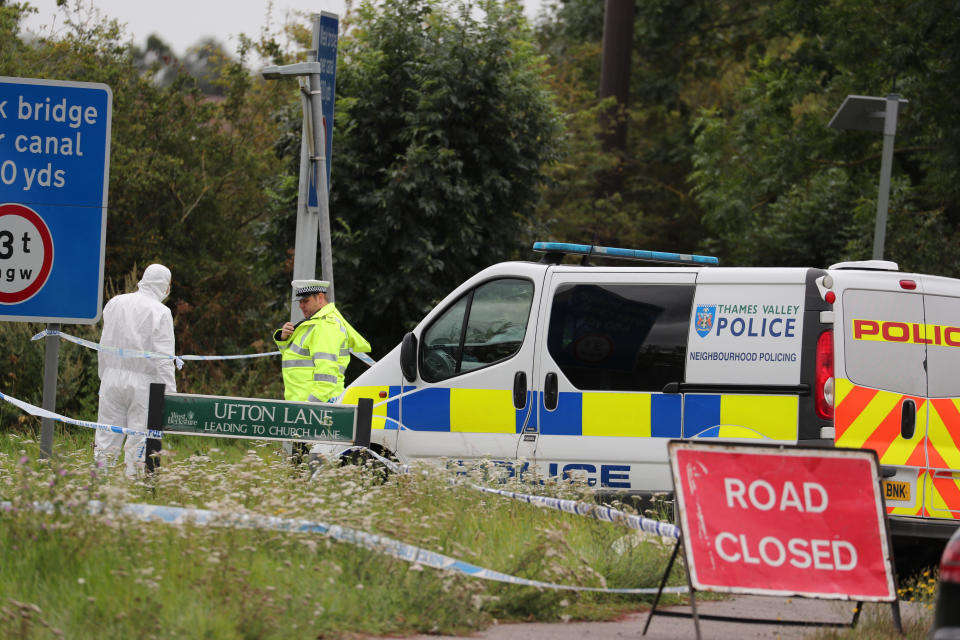 Police officers at the scene on Ufton Lane, near Sulhamstead, Berkshire, where a Thames Valley Police officer was killed whilst attending a reported burglary on Thursday evening.