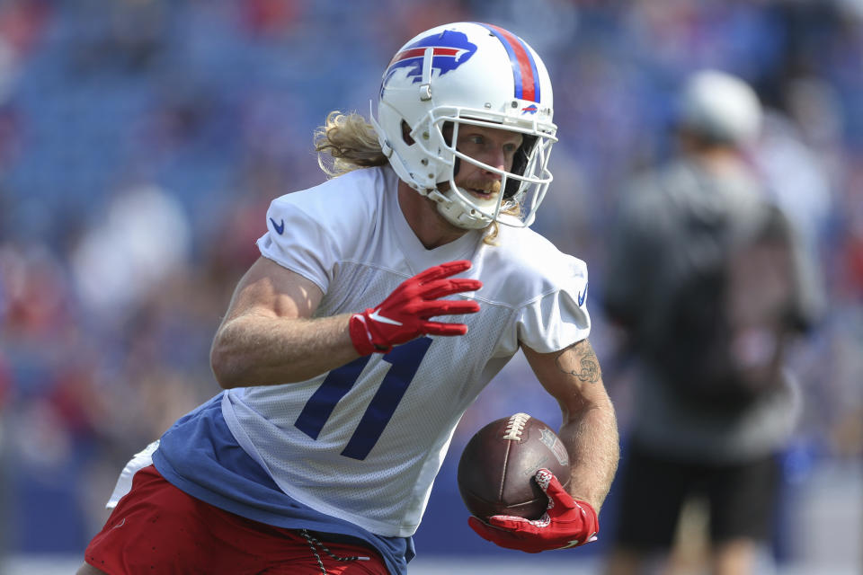 FILE - In this July 31, 2021, file photo, Buffalo Bills wide receiver Cole Beasley (11) runs after a catch during NFL football practice in Orchard Park, N.Y. Now, in the grips of another seminal national tragedy, one that has produced a 9/11-like death toll many days over for the last year and a half, we're much more realistic about the role that sports can play in the recovery process. While most professional and college athletes have gotten vaccinated against COVID-19 — seizing on our best hope to end this scourge — there have been plenty of vocal holdouts who consider it an infringement on their freedom. (AP Photo/Joshua Bessex, File)