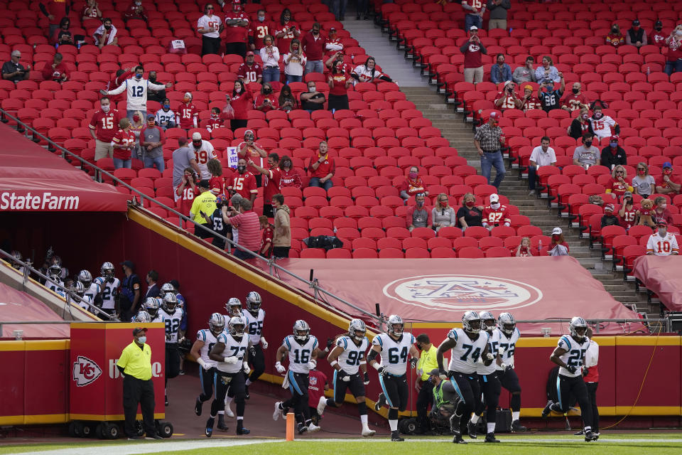 Fans watch as Carolina Panthers players run out of the tunnel at Arrowhead Stadium before an NFL football game between the Kansas City Chiefs and the Panthers in Kansas City, Mo., Sunday, Nov. 8, 2020. (AP Photo/Jeff Roberson)