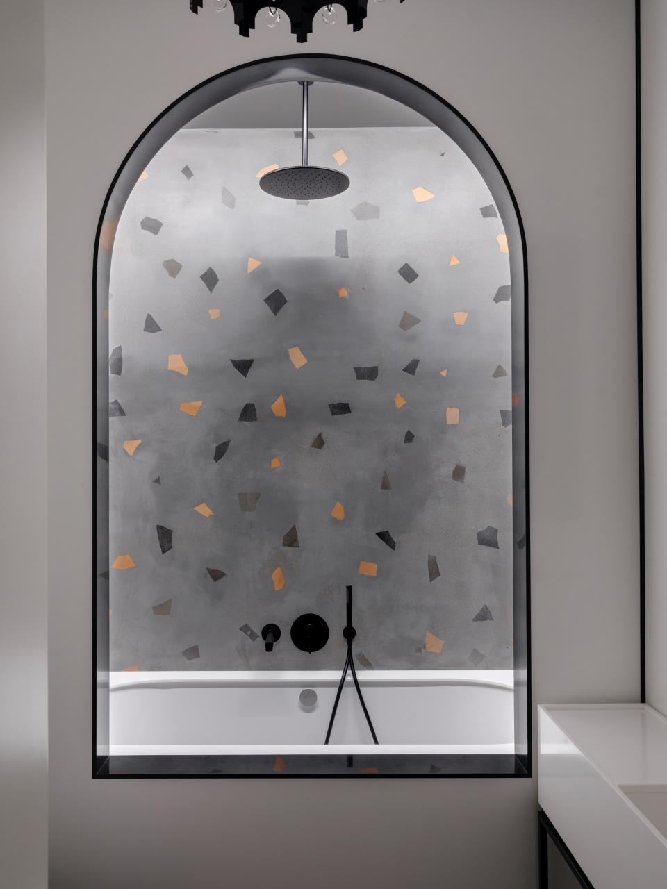 Nuriev devised an abstracted terrazzo pattern for the bath.