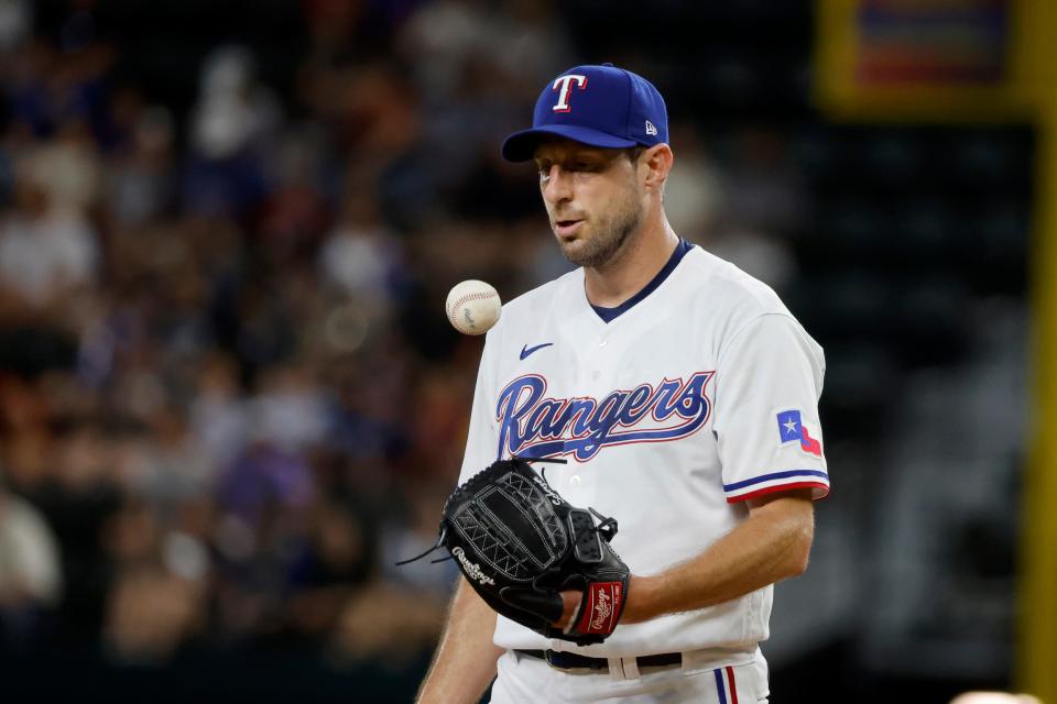 Texas Rangers starting pitcher Max Scherzer prepares for the next pitch against the Chicago White Sox during the second inning of a baseball game Thursday, Aug. 3, 2023, in Arlington, Texas. (AP Photo/Michael Ainsworth)