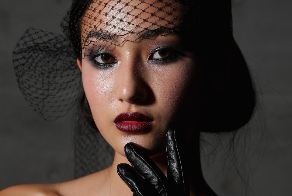 <i>Johanna Johnson’s</i> MBFWA show celebrated the best of the 1920s: opulent beaded dresses, dramatic headwear and moody makeup. Steal this look for a perfect night-time face by combining dark grey smoky eyes complete with heavy black liner, rouged cheeks and deep scarlet lips.