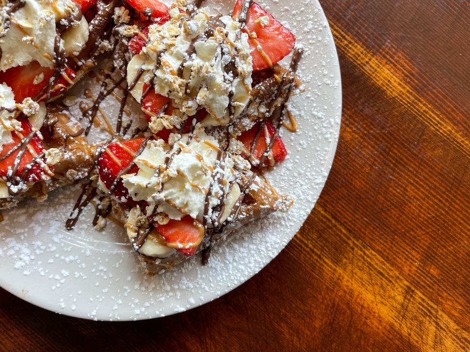 Nomad Coffee Bar in Milwaukee offers waffles on its menu.  Aug. 24 is National Waffle Day.