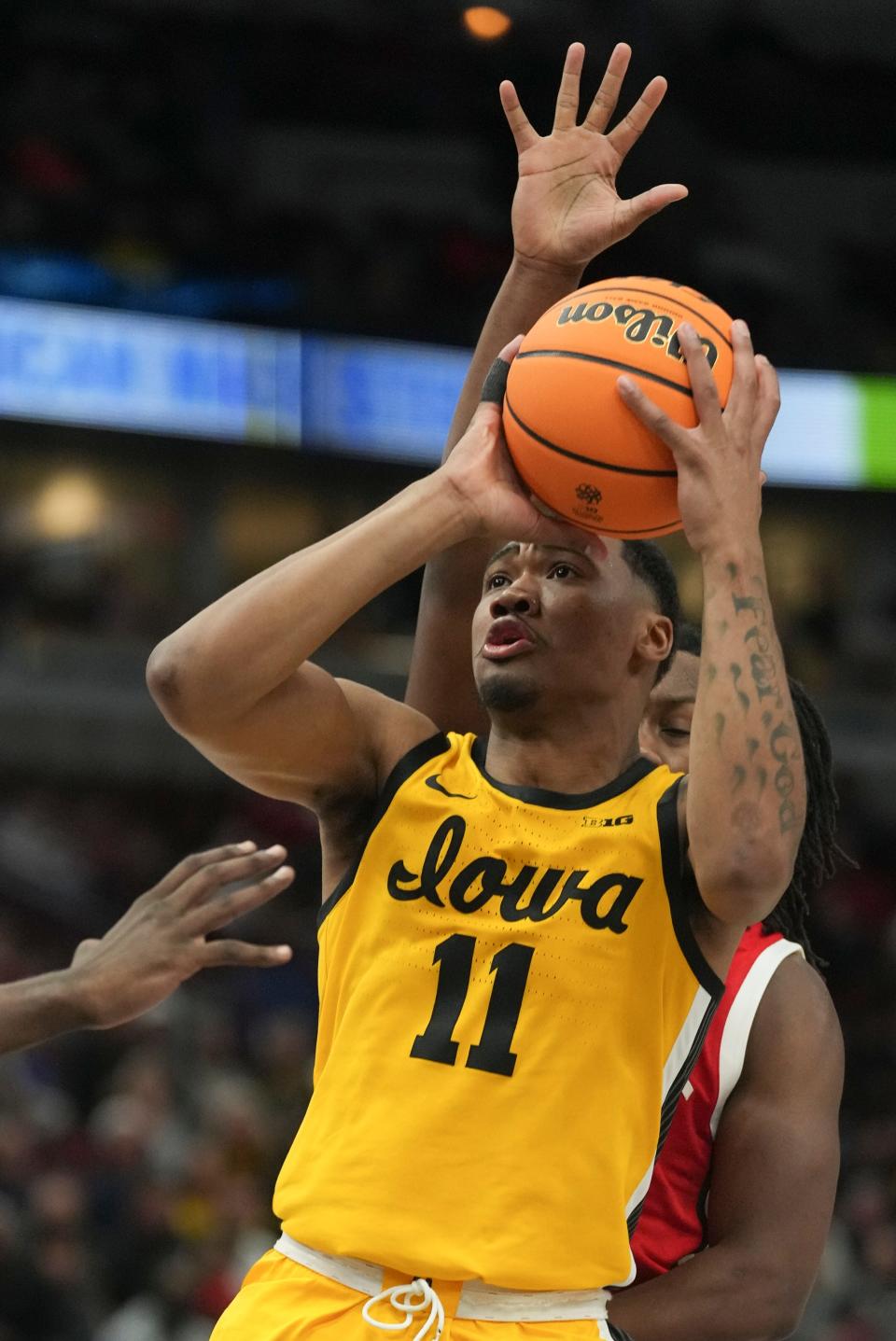 Iowa's Tony Perkins (11) takes a shot during the second half of an NCAA college basketball game against Ohio State at the Big Ten men's tournament, Thursday, March 9, 2023, in Chicago. (AP Photo/Erin Hooley)