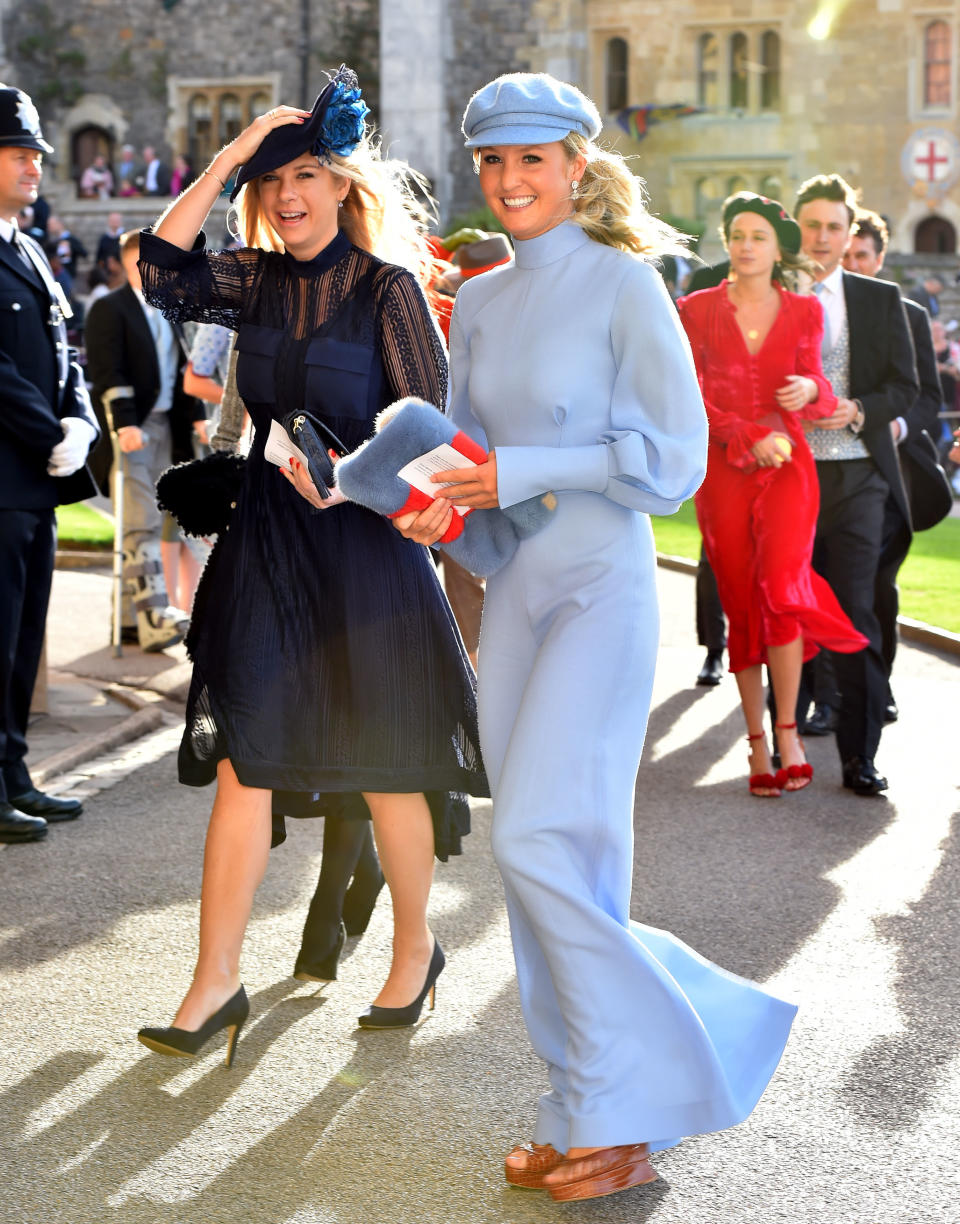 Prince Harry’s ex-girlfriend Chelsy Davy is seen keeping her fascinator secure. (Photo: Getty Images)